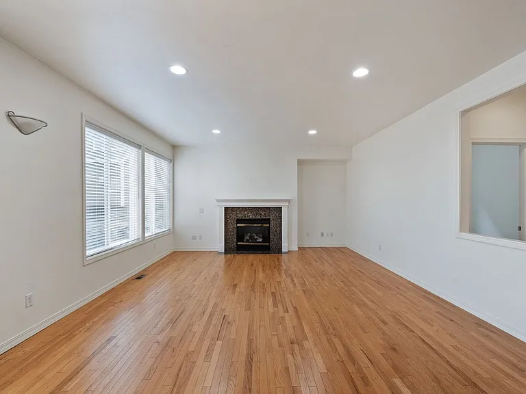 Family and dining room with hardwood floor