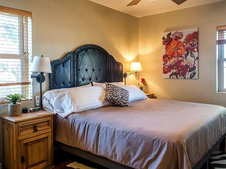 North bedroom fits a King size bed with end tables and long dresser.