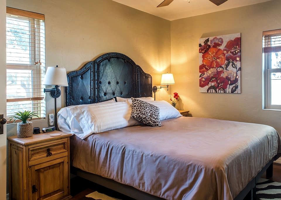 North bedroom fits a King size bed with end tables and long dresser.