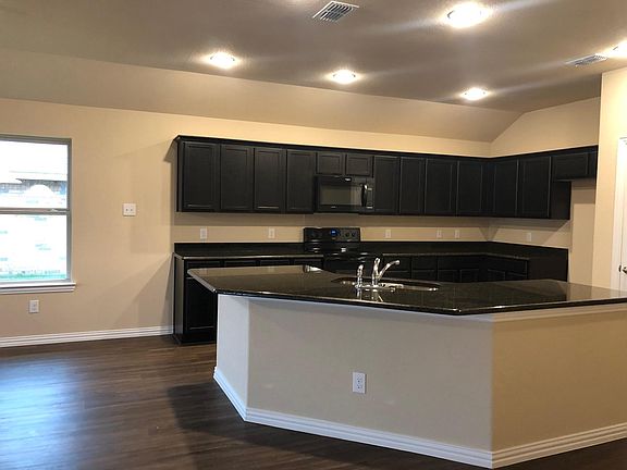 Huge kitchen with granite counter and modern cabinets