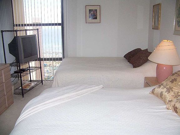 Master bedroom with a glimps of ocean view