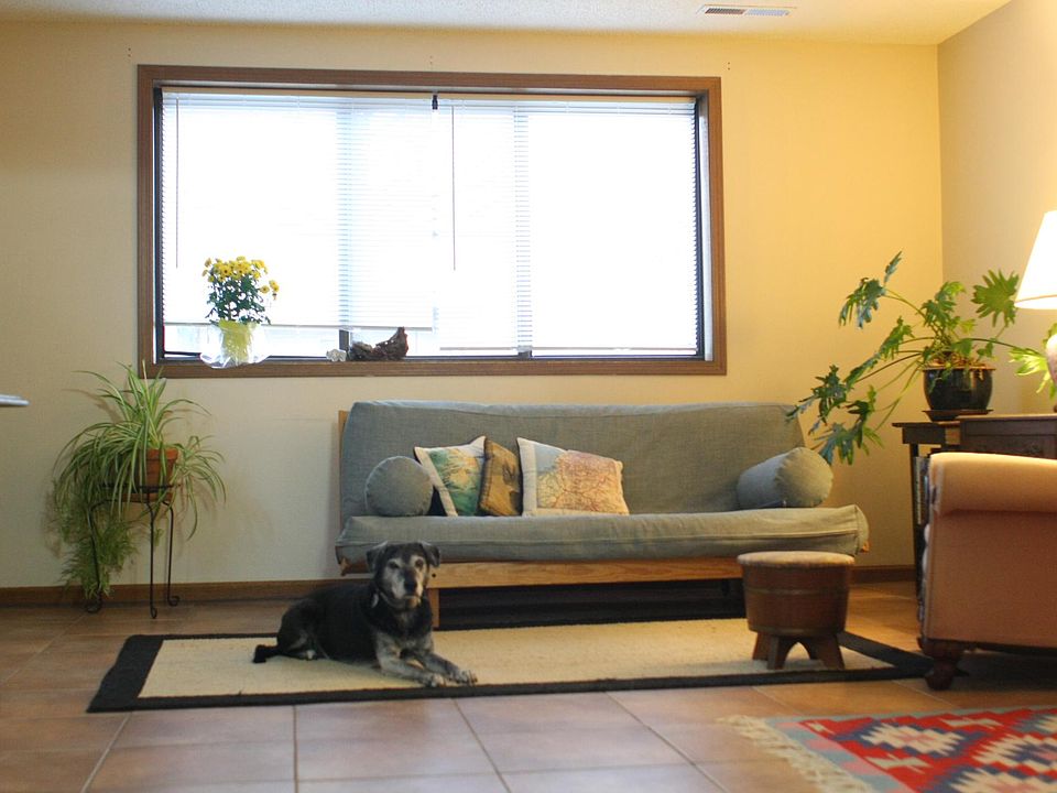 Living room open to kitchen (cute dog not included)