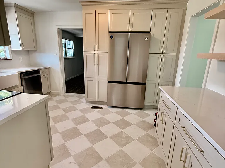 Completely renovated kitchen with new custom cabinets, farmhouse sink, new stainless steel appliances.