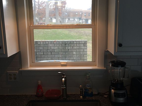 The sink looks out into the shared outdoor area