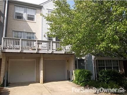 Two bedroom, 2.5 bath Townhome Condo
						:
						Street view of Townhome with NEW DECK, tree shaded entrance and one car garage.
