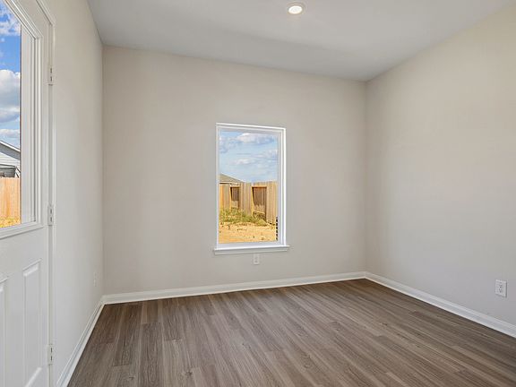 The dining room has a large window that lets in great, natural light.