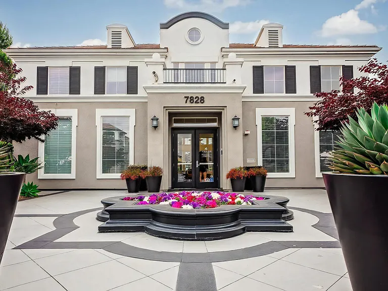 Villas at the Gardens Leasing Office Entry with Elegant Landscaping and Planters