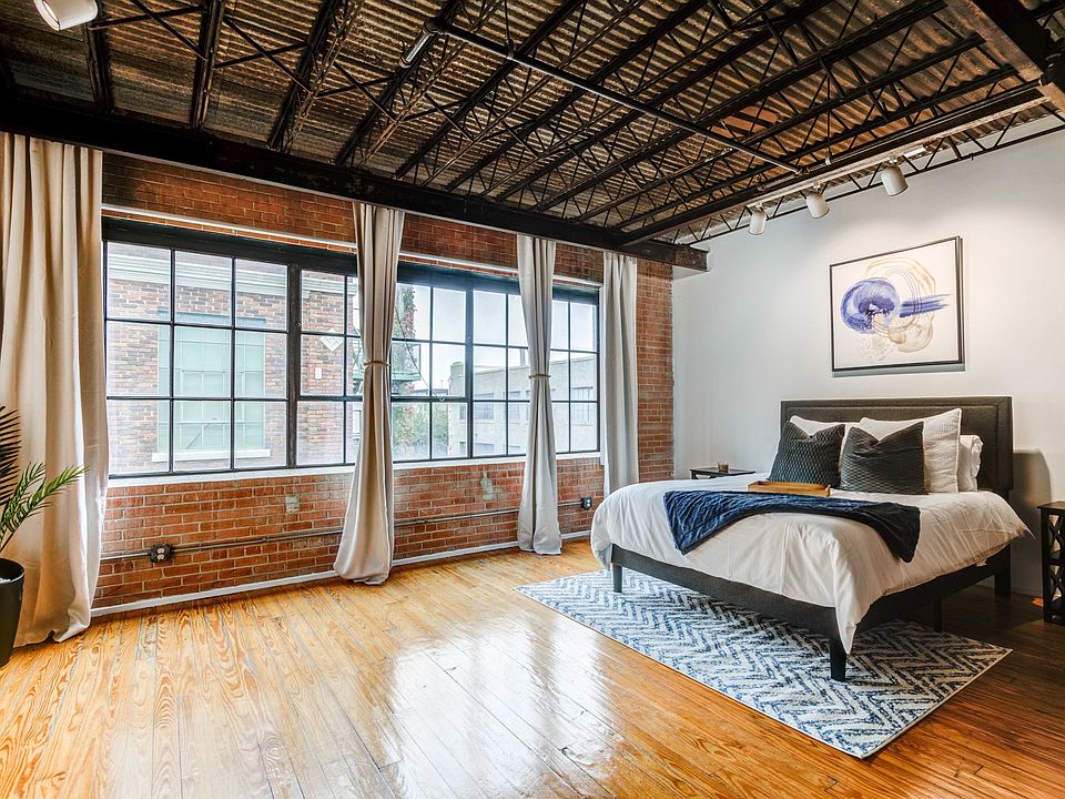 Renovated Lofts with exposed steel beams and brick accents