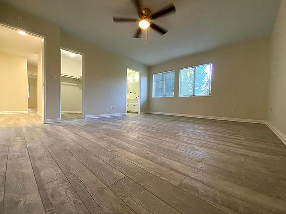 The Master bedroom is spacious. It has two big windows, a walk-in closet, and master bathroom.