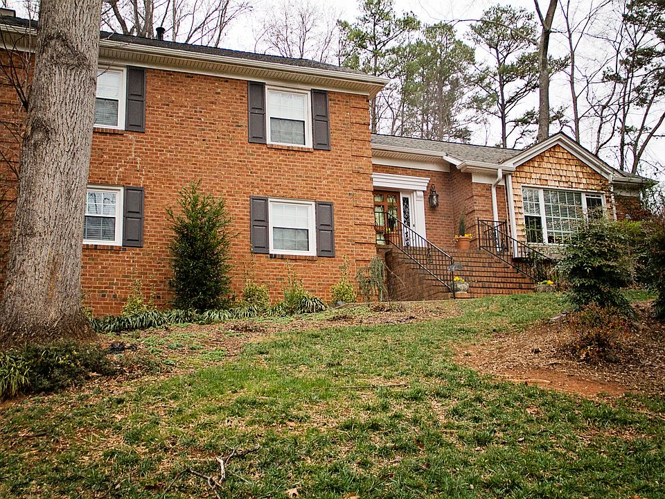 Full brick facade, with cedar shake window feature