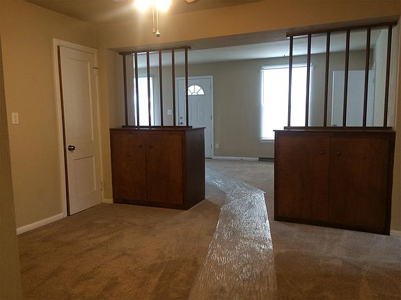 Spacious formal dining area with unique built in cabinets fo