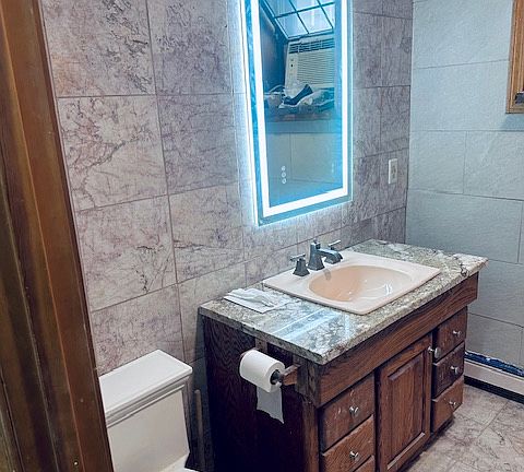 Heated anti fog mirror in spa bathroom.