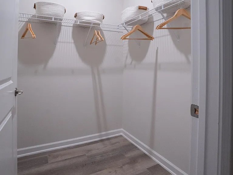 Primary bedroom walk-in closet