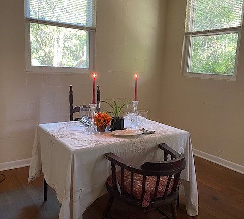 The dining area of the living room/dining room combo, with two new windows.