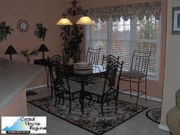Kitchen Nook where table stays to enjoy the beatuiful view of the back yard.