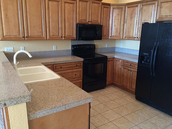 Open floor plan lets you be with family throughout the day and evening. Great for having Guest. Microwave, dishwasher and garbage disposal. Ref. has ice maker and there is a Coin washer and dryer off the main hall going to the 3 apartments.