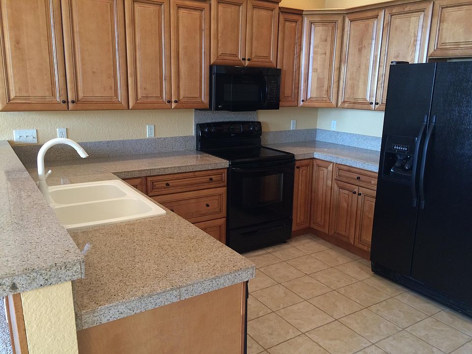 Open floor plan lets you be with family throughout the day and evening. Great for having Guest. Microwave, dishwasher and garbage disposal. Ref. has ice maker and there is a Coin washer and dryer off the main hall going to the 3 apartments.