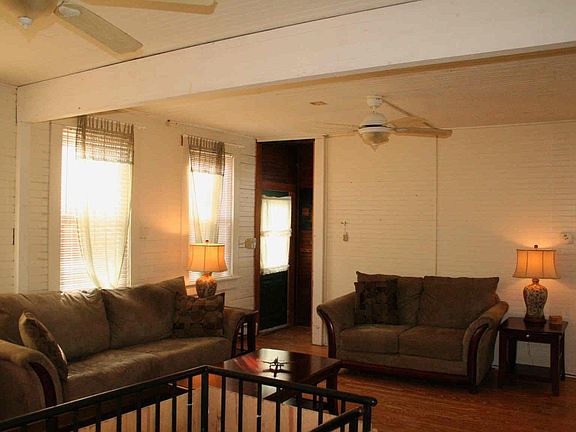 Large windows, natural light and a spiral staircase leads to the stone cellar.