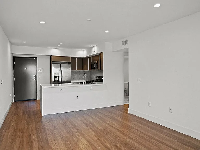 Front Entryway, Kitchen, and Dining Room Area
