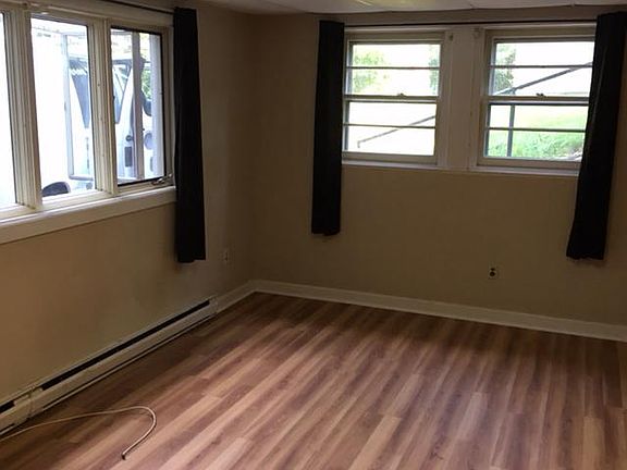 Large bright living room with new plank flooring 