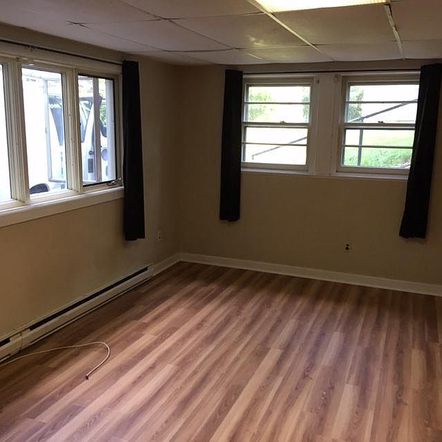 Large bright living room with new plank flooring 