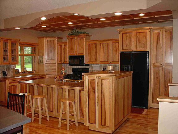 Custom kitchen with gorgeous black hickory cabinetry w/ black walnut accents.