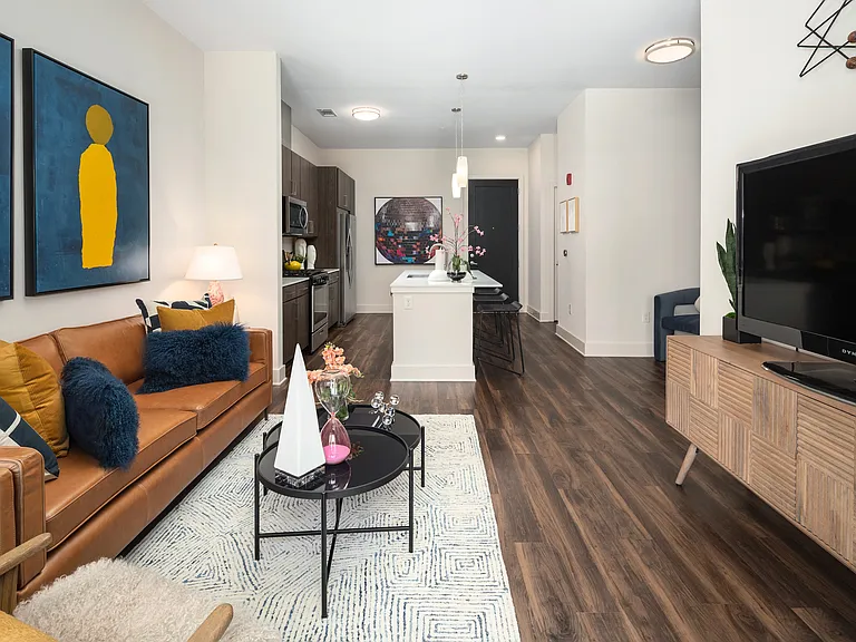 Apartment Living Room Featuring Contemporary Furniture and Large Patio Door