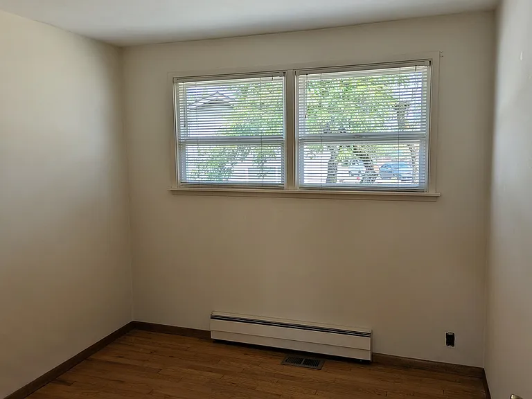 Middle bedroom with hardwood floors