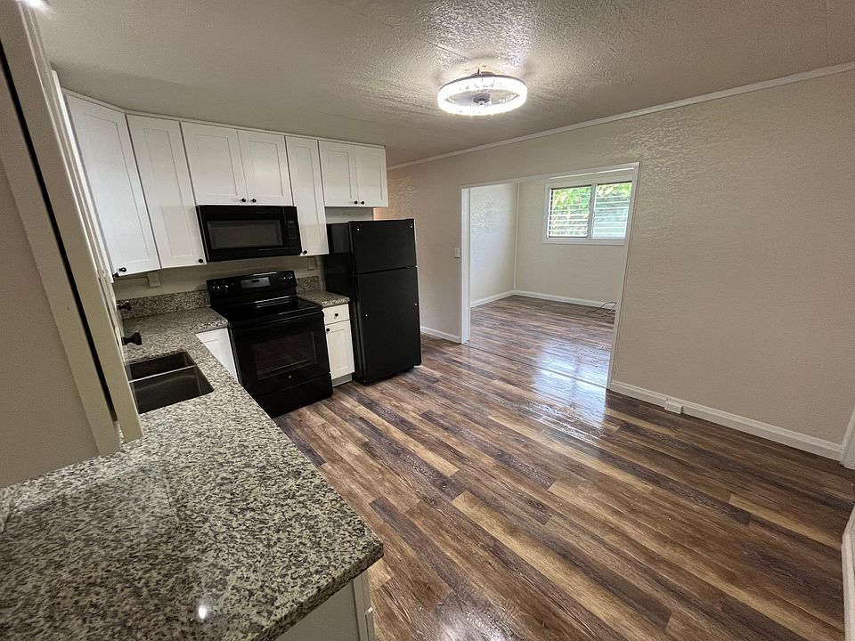 Full kitchen & living room view