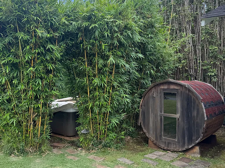 wooden barrel sauna and bamboo enclosed jacuzzi