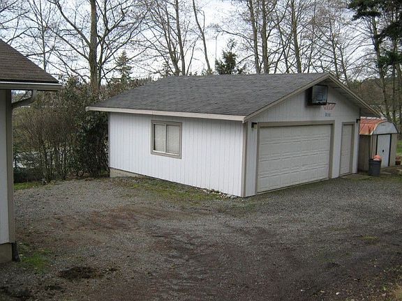 Large double garage with opener and parking between home and garage.
