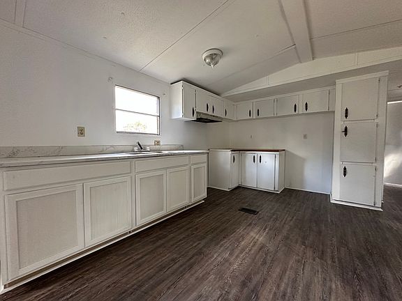 Kitchen with lots of cabinets.