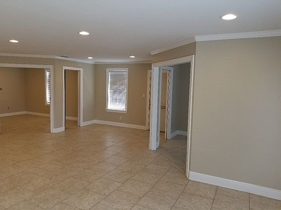Open area facing the back with the back office in the left corner