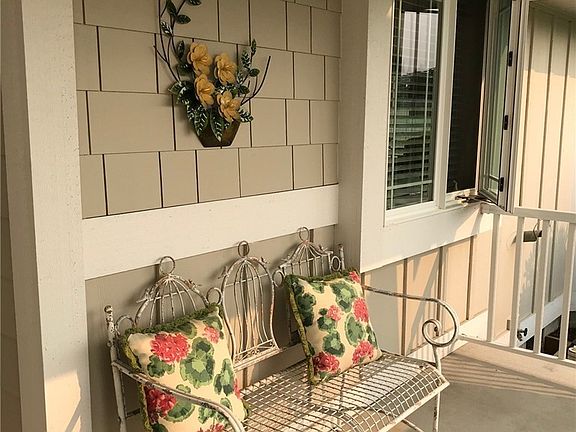 Covered front porch has skylights