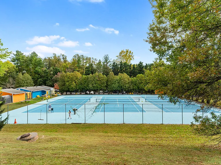 Multiple tennis courts at East Gate of Potomac Swim and Tennis Club only 2 blocks away