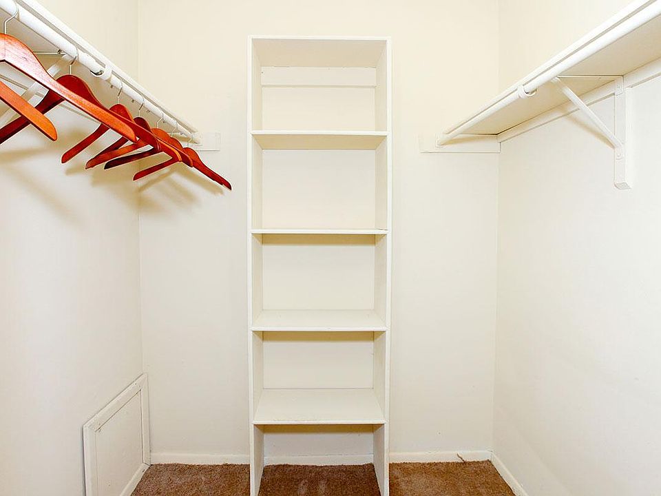 Huge walk in closet with built in storage
