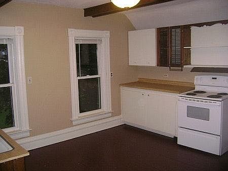 Open Kitchen with dining nook between the 2 windows