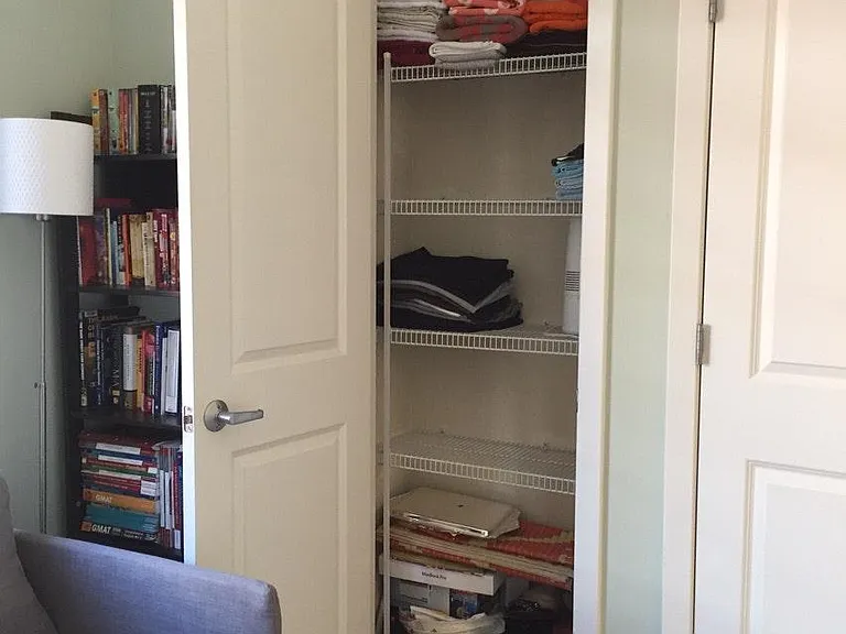 Linen closet in guest bedroom