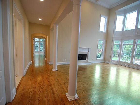 Family Room: decorative columns, second floor balcony