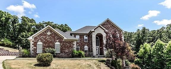 Welcome to 18474 Hollow Hills Drive - spectacular entrance to this home.
