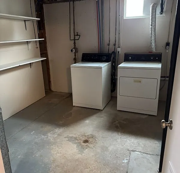 Basement laundry and storage room off basement family room