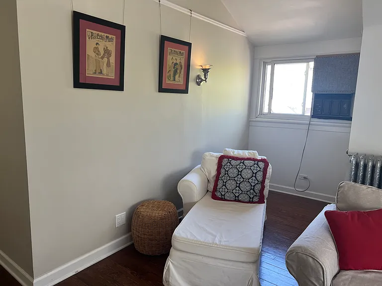 Chaise Lounge with wicker side table and Vintage framed Parisian Fashion Prints purchased from a street vendor on the Seine in Paris.