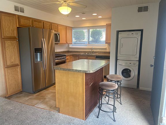 Kitchen with Island seating and laundry