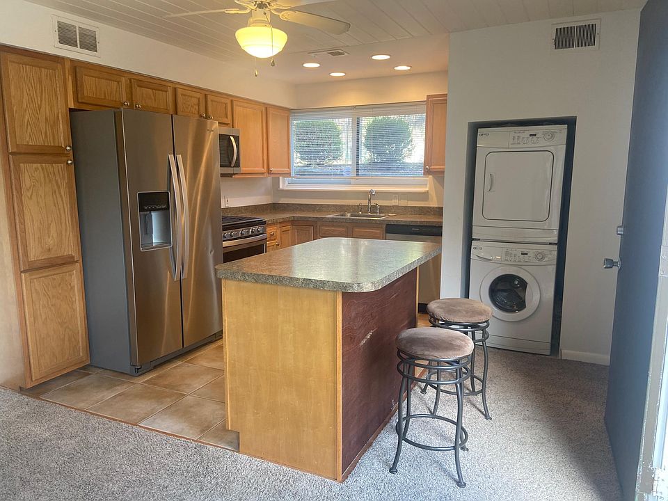 Kitchen with Island seating and laundry