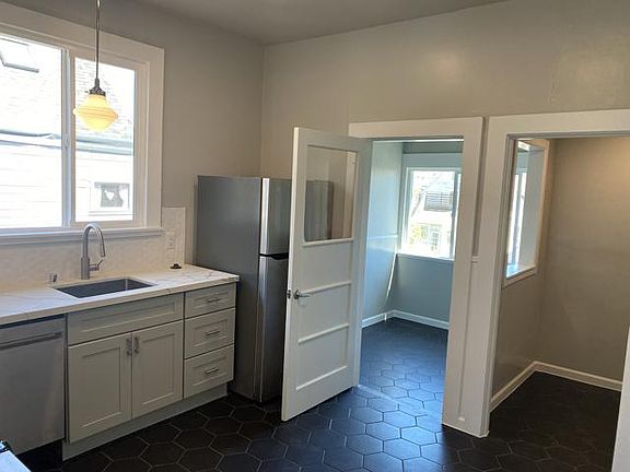 Kitchen. The left side door leads to the office and on the right there is a pantry.