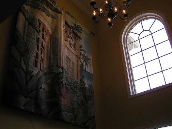 arched window above front door