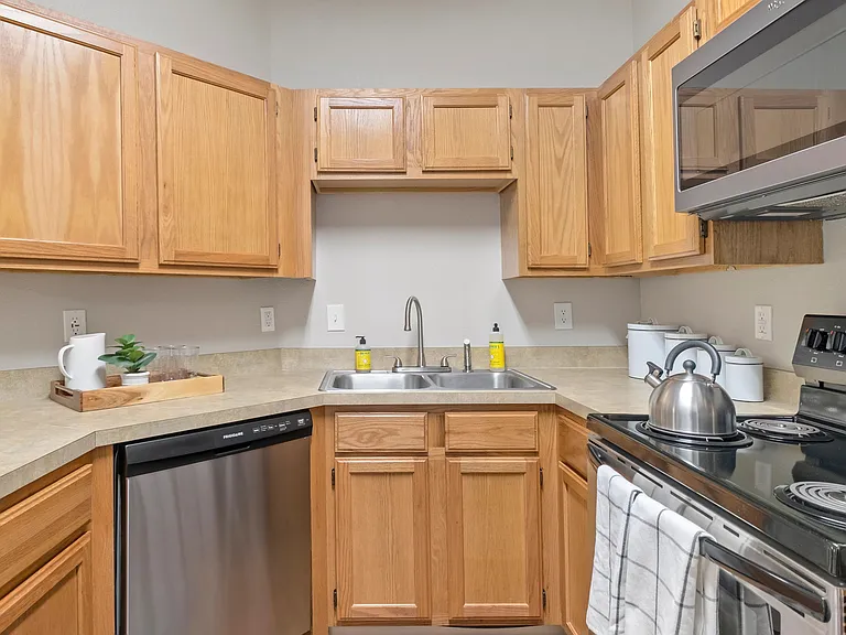 Savor the convenience of a breakfast bar, providing a perfect setting for meal prep and open conversations.