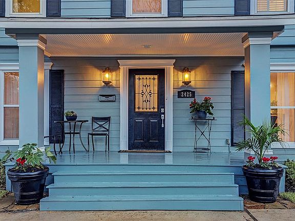 Sit and relax on this charming covered porch.