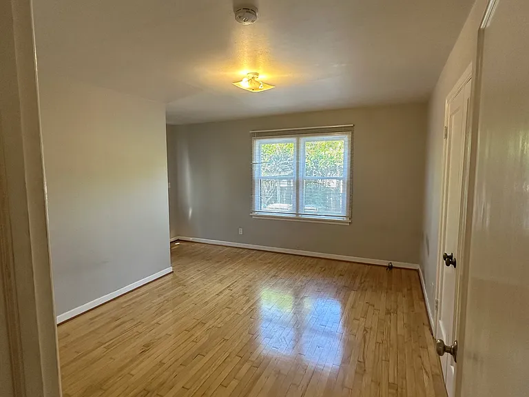 Bedroom 2 with exterior door to the backyard