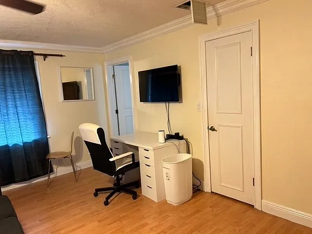 desk and chair with smart TV